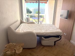 Couchant Cosy studio, terrasse couverte face à la mer, clim, parking, wifi