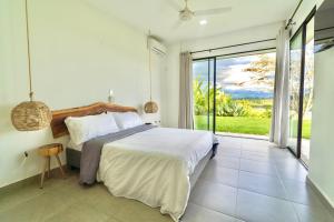 Modern Villa Surrounded by Nature and Gardens with Pool and Stunning Mountain and River Views