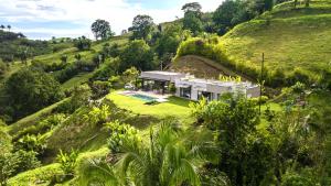 Modern Villa Surrounded by Nature and Gardens with Pool and Stunning Mountain and River Views