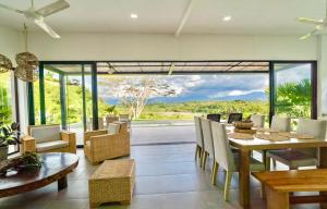 Modern Villa Surrounded by Nature and Gardens with Pool and Stunning Mountain and River Views