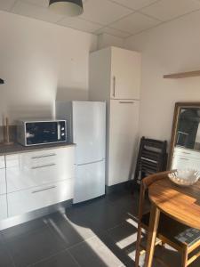 Appartements Chez Ambre et Lulu - Appartement centre ville avec piscine : photos des chambres