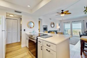 Modern oceanfront condo with outdoor pool, balcony, & washerdryer