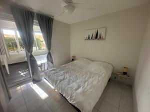 Appartements Front mer magnifique appartement en rez-de-jardin : photos des chambres
