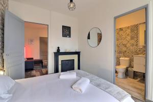 Appartements Les Apparts du Pont Vert - lit double - WiFi - tout inclus - 3 : photos des chambres