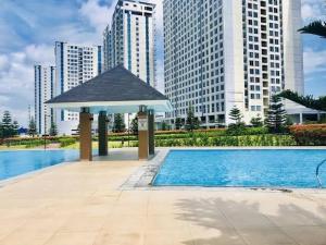 Wind Residences Cool suites 1BR unli Wifi, PrimeVideo, Nice pool, Near Malls