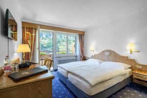Superior Double Room with Matterhorn View and Balcony or Ground Floor Terrace room in Hotel Alpenroyal