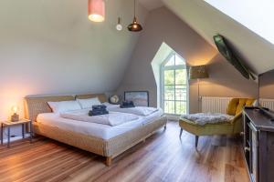 Ferienhaus Süderpiep – 4 individuelle Ferienwohnungen nahe Südstrand Ferienwohnung Auster – helle Maisonette mit 2 Schlafzimmern & Balkon