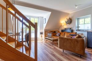 Ferienhaus Süderpiep – 4 individuelle Ferienwohnungen nahe Südstrand Ferienwohnung Auster – helle Maisonette mit 2 Schlafzimmern & Balkon