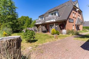 Ferienhaus Süderpiep – 4 individuelle Ferienwohnungen nahe Südstrand Ferienwohnung Robbe – stilvolle EG-Wohnung mit Terrasse in Strandnähe