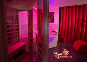 Appartements Nuit Defendue Jacuzzi-Sauna : photos des chambres