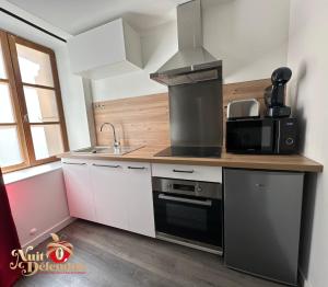 Appartements Nuit Defendue Jacuzzi-Sauna : photos des chambres