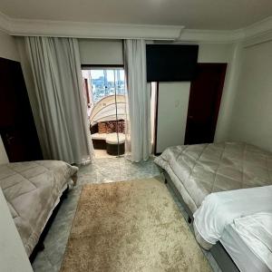 Loft Lux SM 15 (Jacuzzi, Smart TV, Ar condicionado, Cozinha)