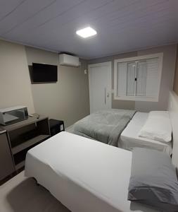 Loft Lux 4 Centro (Smart TV, ar-condicionado e cozinha completa)