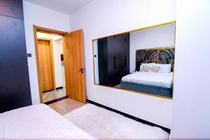 luxurious two bedroom apartment with well equipped gym, swimming pool, ample parking space and a relaxing rooftop with amazing city views