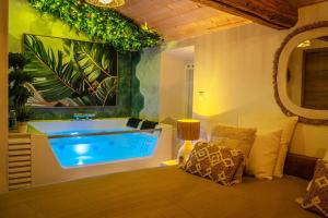 Appartements Loft & Spa Scandinave Romantique, King Size, TV 65 : photos des chambres