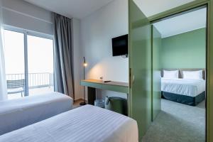 Family Room (2 Adults + 2 Children) with Sea View room in Messinian Bay