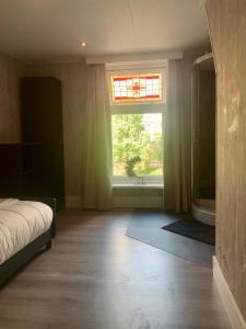 Klassiek veluws huis onder de beuken