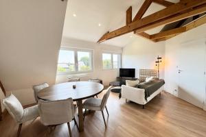 Appartements Duplex T3 - Au coeur des chenes : photos des chambres