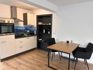 Apartment im Souterrain mit Terrasse