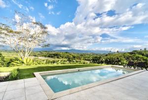 Modern Villa Surrounded by Nature and Gardens with Pool and Stunning Mountain and River Views