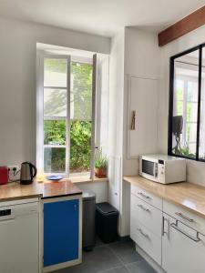 Maisons de vacances House with garden - city center : photos des chambres