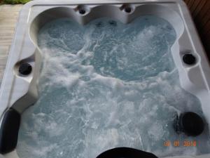 Chalets Le Chalet au vieux vignoble avec espace Sauna et Jacuzzi : photos des chambres