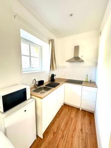 Appartements Studio cosy face a l-eglise : photos des chambres