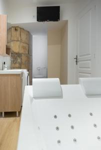 Appartements Semillon - Baignoire Balneo plein centre : photos des chambres