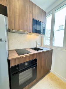 Appartements Appartement seduisant Paris - Clichy : photos des chambres