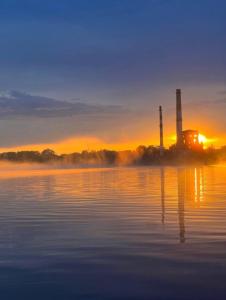 Natura Park Jurmala campsite with tent sites near a river