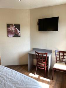 Hotels La Pomme de Pin : photos des chambres