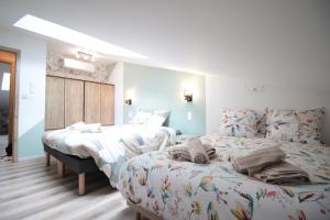 Appartements Verdun Centre - Full climatisation - 3 chambres - 7 couchages - 10 personnes - Parking Proche - Terrain 800m2 - Balneotherapie - Air de jeux exterieurs - TOP CONFORT - Gere par PrestaZen-Services : photos des chambres
