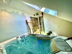 Appartements Nid douillet sous les toits avec jacuzzi : photos des chambres
