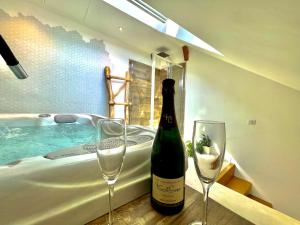 Appartements Nid douillet sous les toits avec jacuzzi : photos des chambres