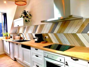 Appartements Nid douillet sous les toits avec jacuzzi : photos des chambres