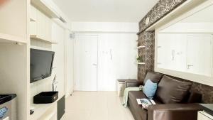 Strategic and Cozy 2BR Bassura City Apartment By Travelio