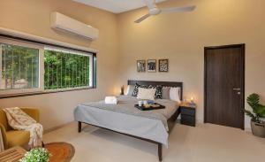 SaffronStays Nilaya by the River - 3BR riverside villa with private pool, bonfire, BBQ & river views