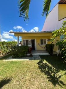 Casa pé na areia em condomínio