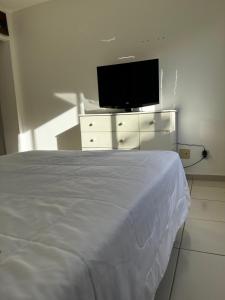 Apartamento completo a 2 min à pé da praia