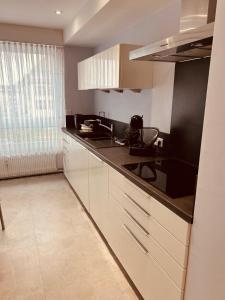 Appartements Comme ailleurs : photos des chambres
