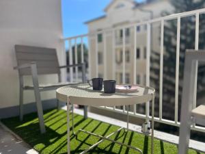 Appartements La Cite Guillemaud 1930, parking, balcon et wifi : photos des chambres