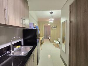 1BR Condotel with Balcony at FAME Residences #FM62-1
