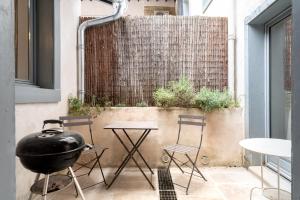 Maisons de vacances Au Pied de la Cite - Terrasse - Climatisation - Wifi : photos des chambres