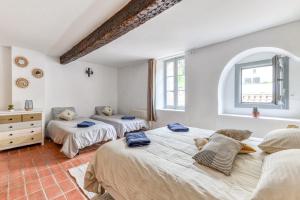 Maisons de vacances Au Pied de la Cite - Terrasse - Climatisation - Wifi : photos des chambres