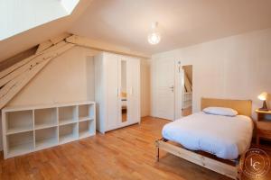 Maisons de vacances Maison centre-ville avec jardin : photos des chambres