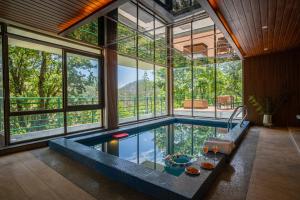 Stunning Hillside 3 BHK Gateway With Indoor Pool, Attic and Classy Interiors