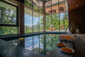 ELIVAAS Blushing Pines 3 BHK With Indoor Pool, Attic and Classy Interiors