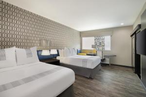 Queen Room with Two Queen Beds and Roll-In Shower - Disability Access room in GLo Best Western Tulsa-Catoosa East Route 66