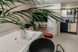 Appartements Reve Tropical Balneo - Votre Pause Enchantee : photos des chambres