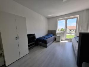 Unterkunft mit 4 Schlafzimmern - ideal gelegen bei Flughafen, Porsche & DHL